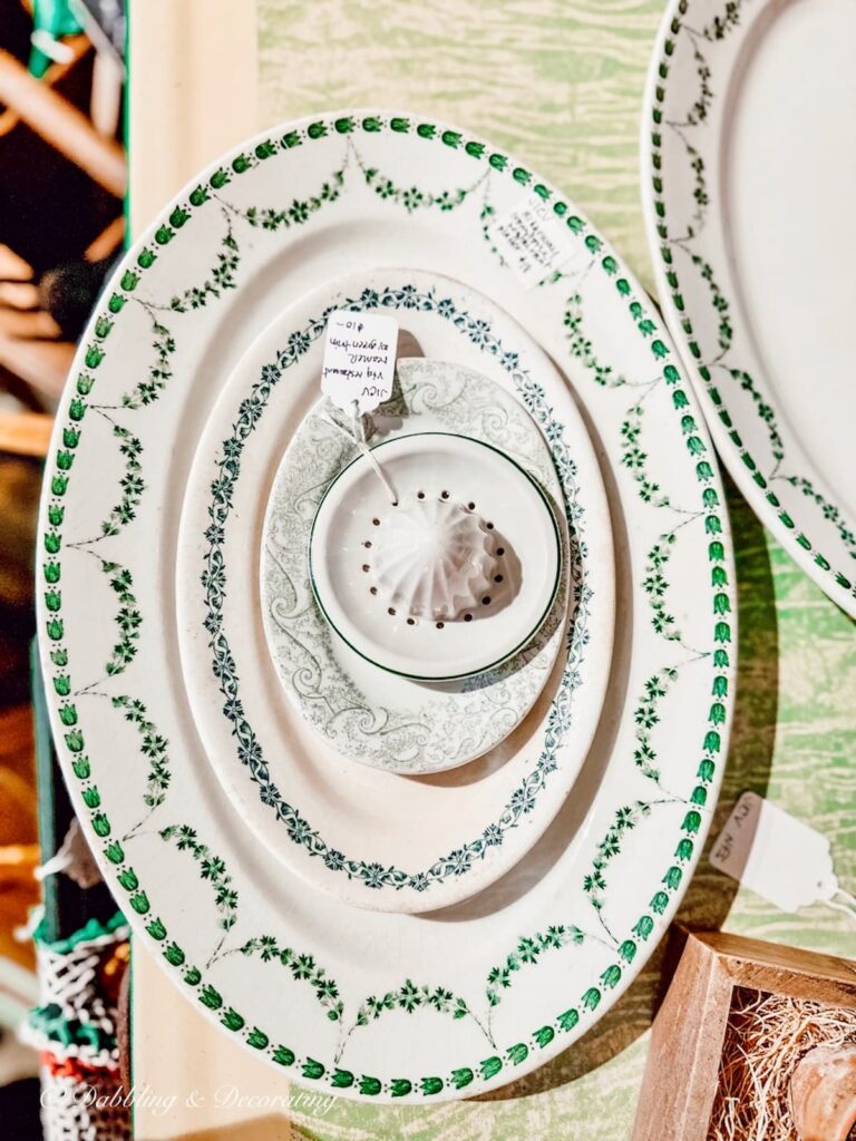Multiple green and white ironstone platters