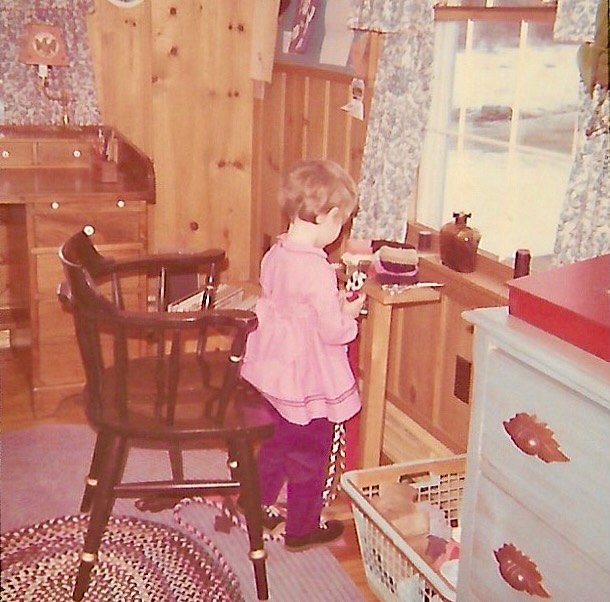 Child braiding a rug