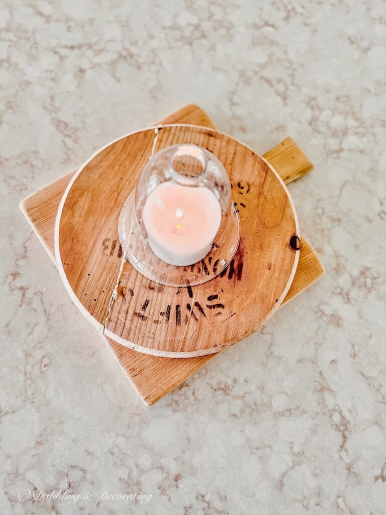 Breadboards with candle and cloche