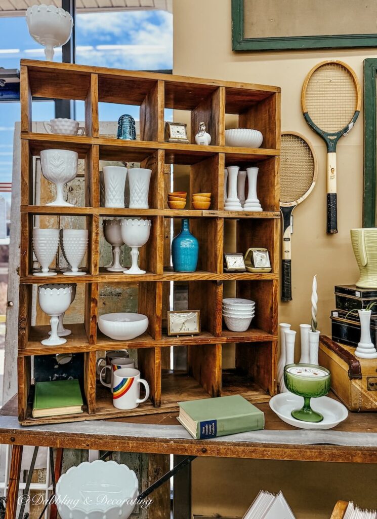 Vintage wooden shelving with vintage decor collections at Vintage Bazaar New England.