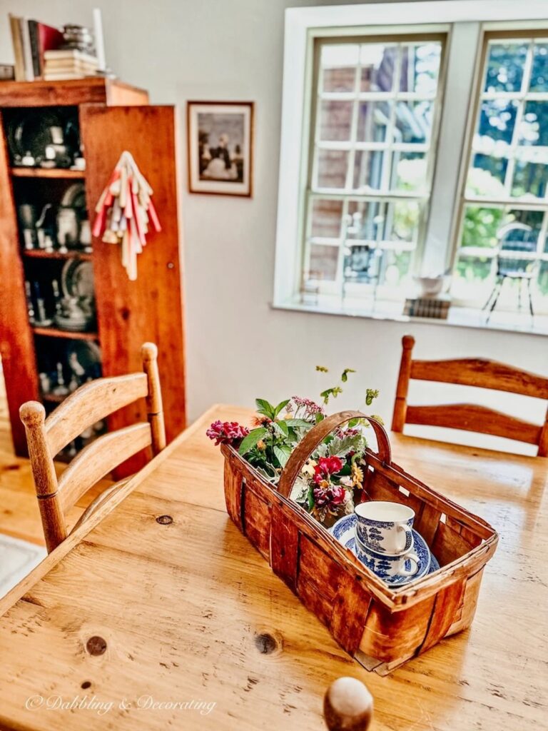 Vintage Basket with Flowers and Dishes