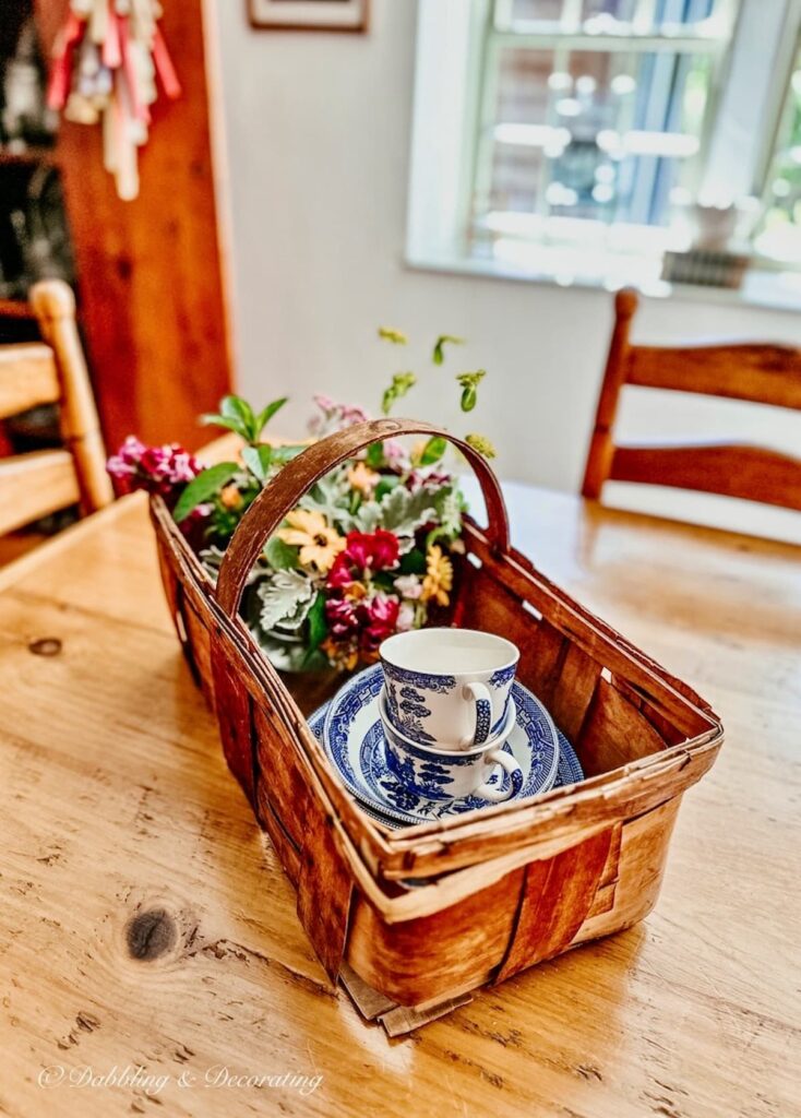 Antique Basket with Flowers and Dishes