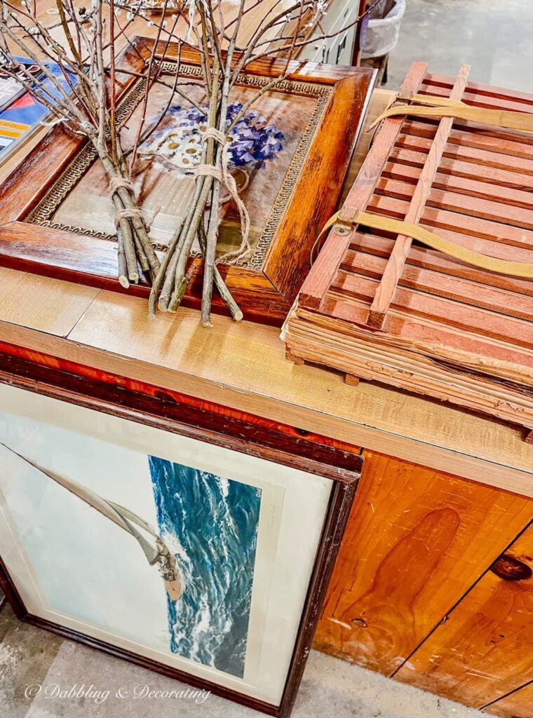 Nautical ship print by Montague Dawson and other finds at antique store counter in Vermont.