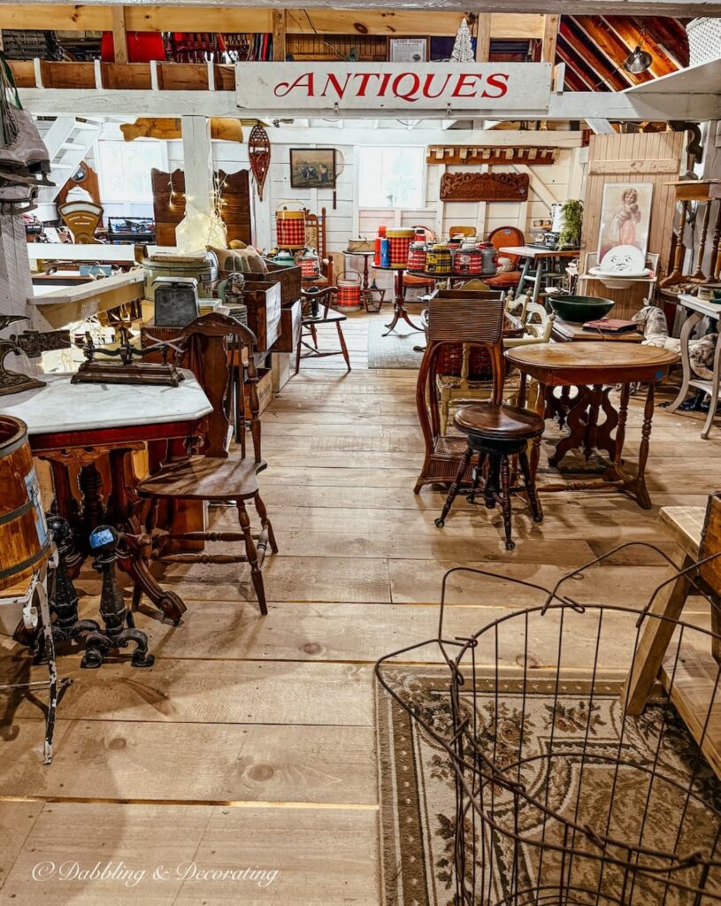 Inside the Chandler & Co. Barn Sale in Berwick, Maine filled with antiques and vintage furniture charm.