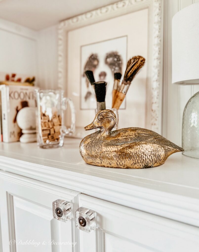 Vintage Brass Duck on Bookshelf