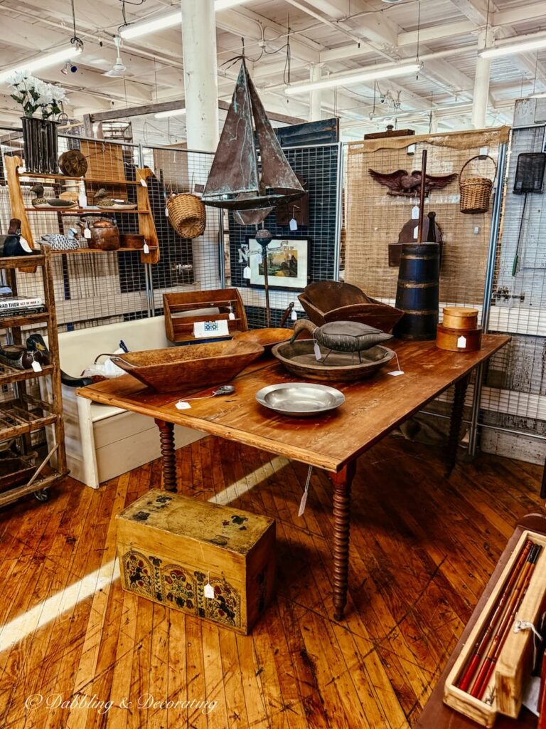 Coastal antiques inside a vintage booth at Cabot Mill Antiques in Brunswick, Maine.