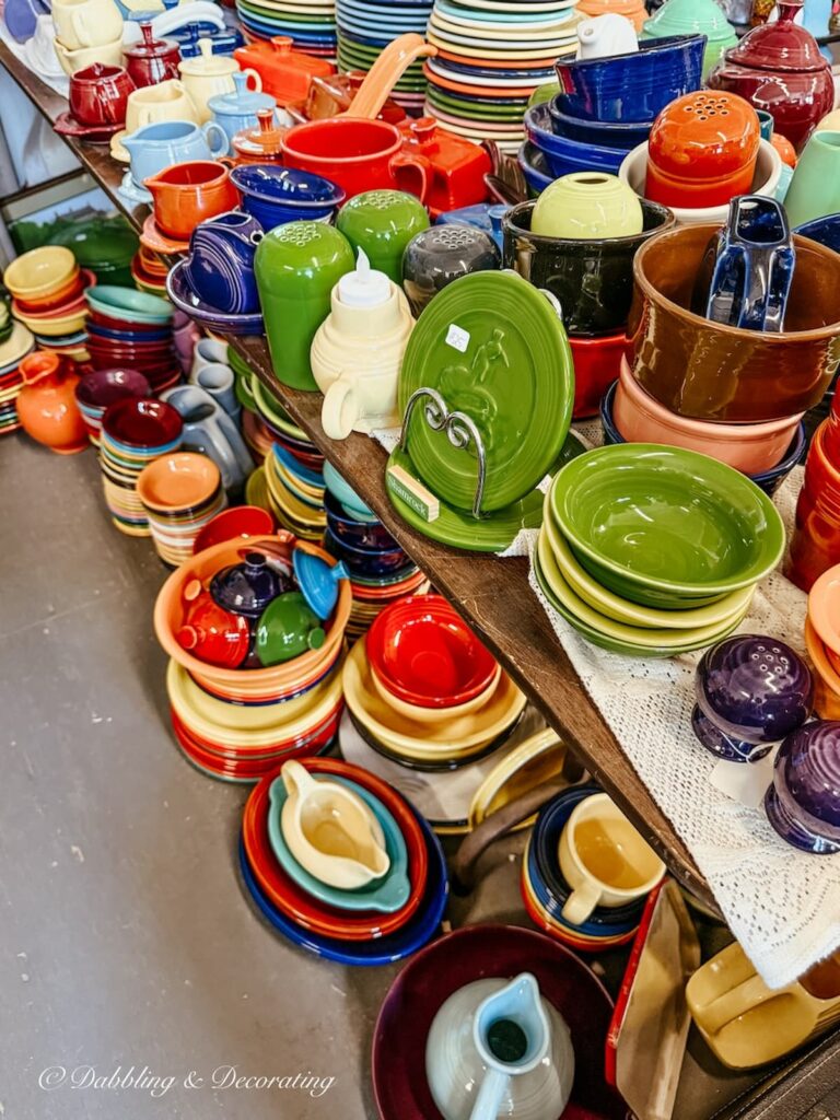Collections of colorful vintage dishes, bowls, pitchers and more at the Waterfront Flea Market in Brunswick, Maine.