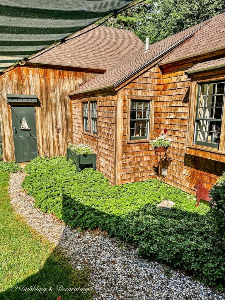 Cedar Shake Home with Pea-Stone Walkway