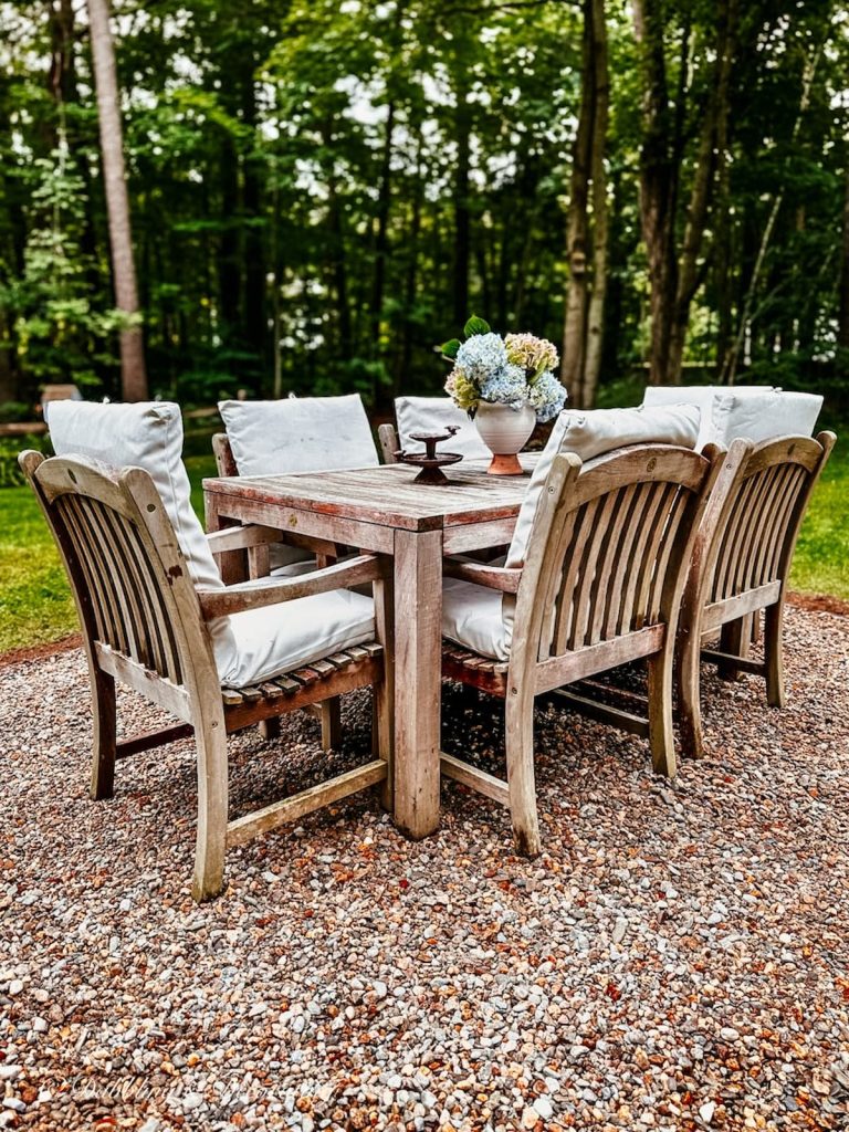 Outdoor Pea Stone Patio with Teak Table Setting