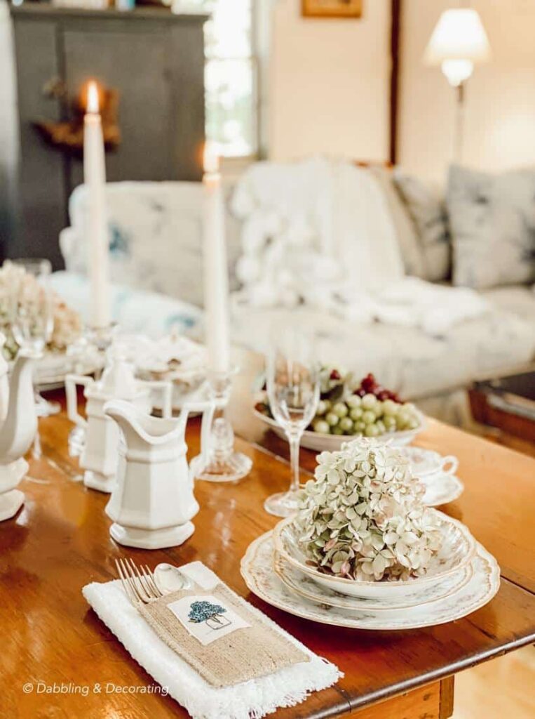 Fireside Hearth and Home place setting on wooden table.