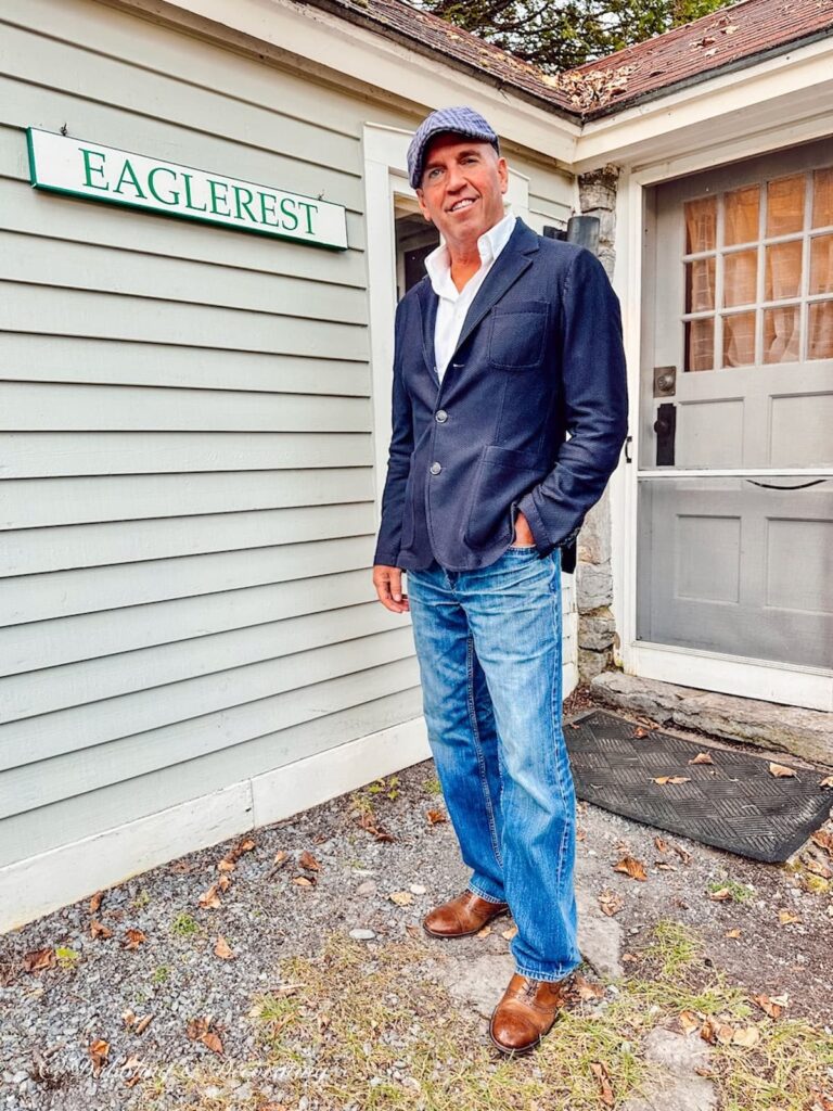 Man standing next to Eaglerest cottage