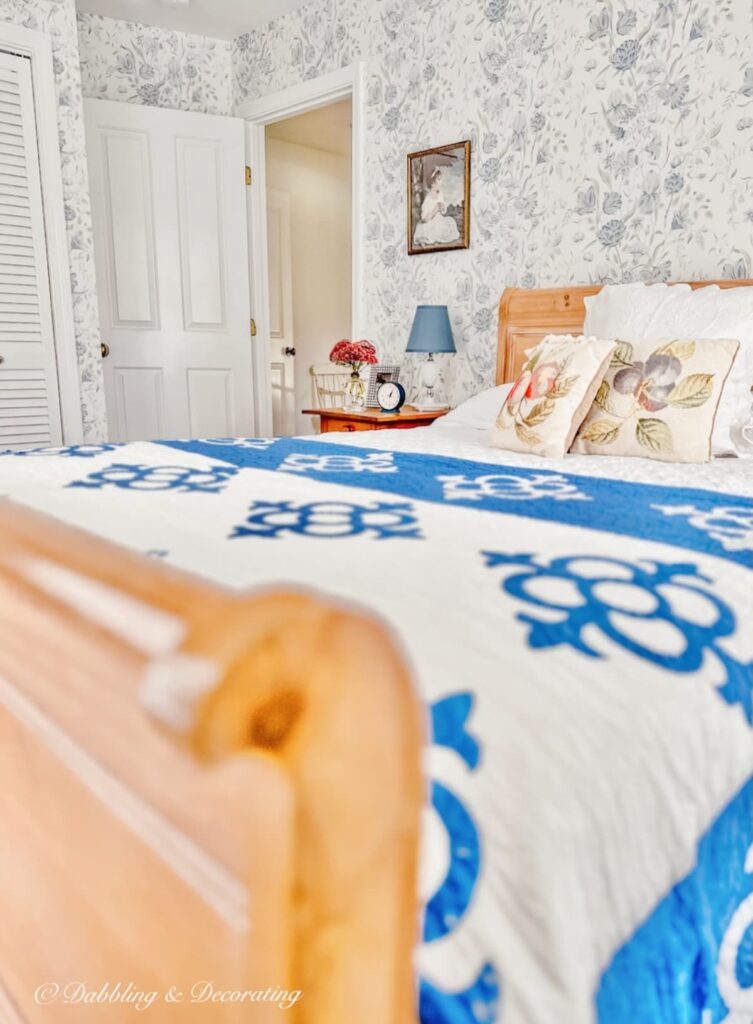 Vintage aesthetic bedroom with sleigh bed.