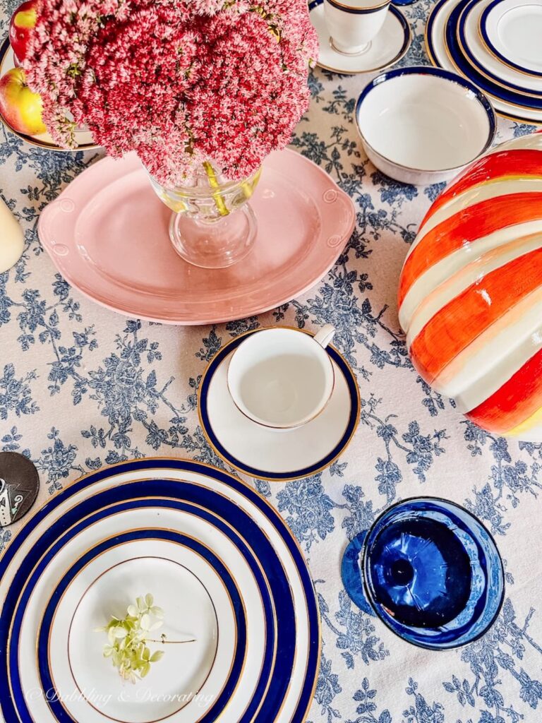 Pink, Orange, and blue and white fall decor table 2023