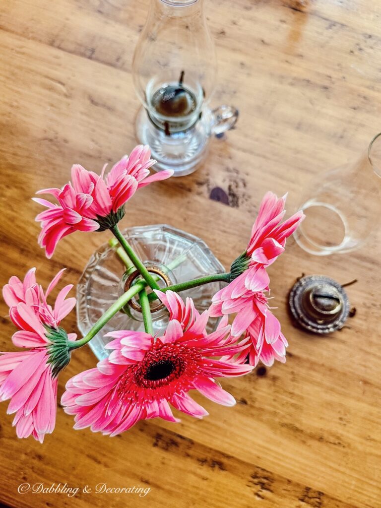 Oil Lamp with Gerbera Daisies in unique flowers vase