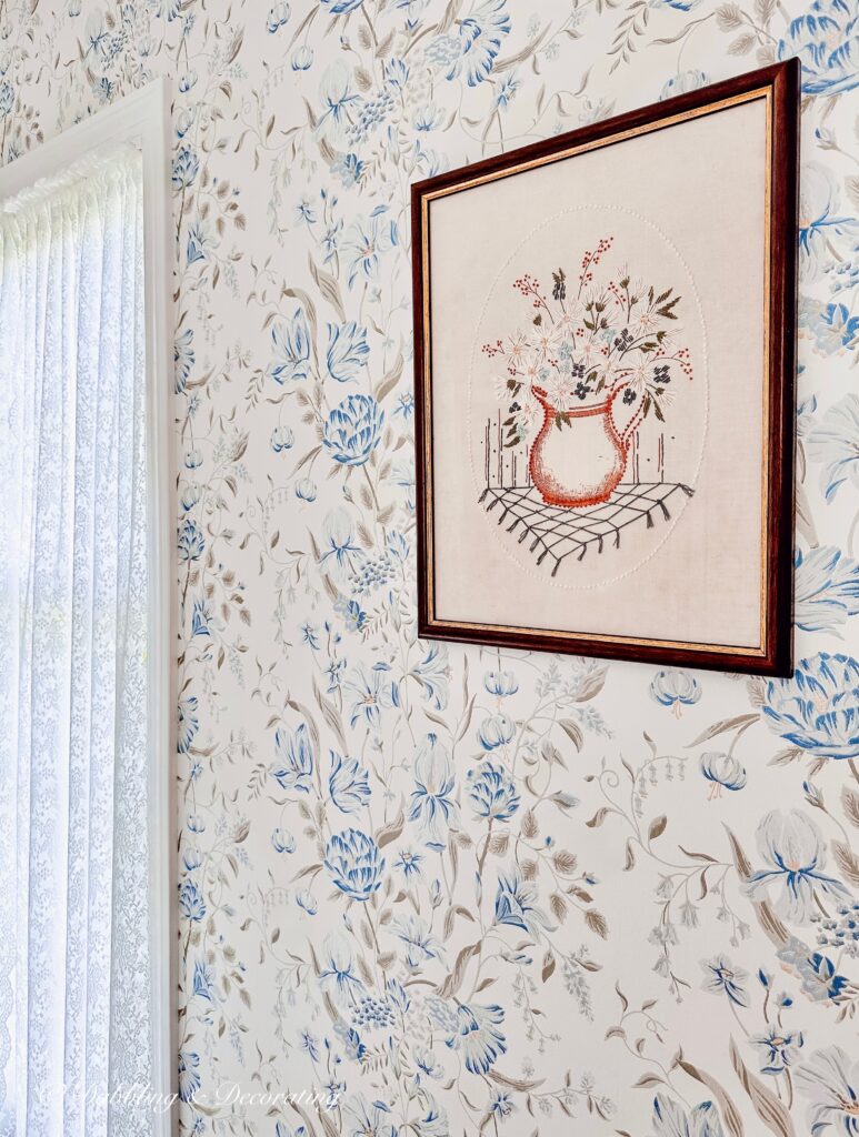 Vintage Needlepoint on Bedroom Wall in vintage aesthetic bedroom