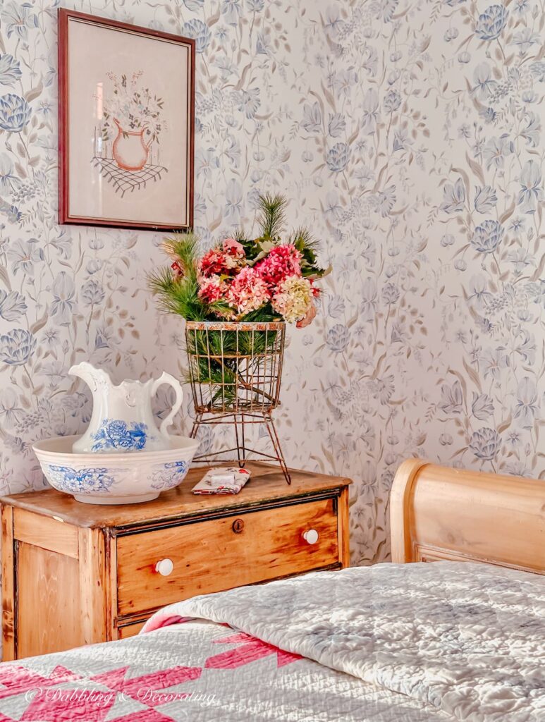 Vintage Aesthetic Bedroom with Dresser and flower arrangement.