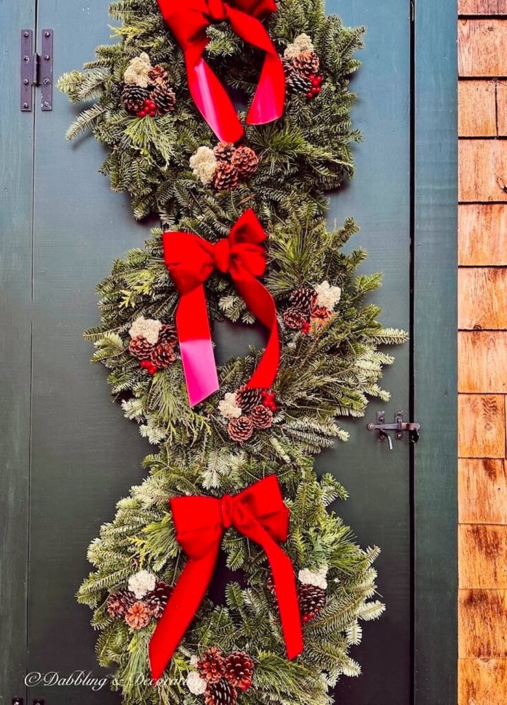 Three 1930s front door Christmas Wreaths on Door