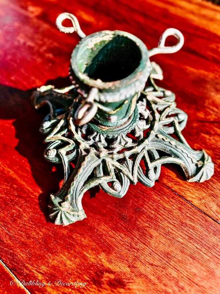 Vintage metal Christmas Tree Stand in dark green.