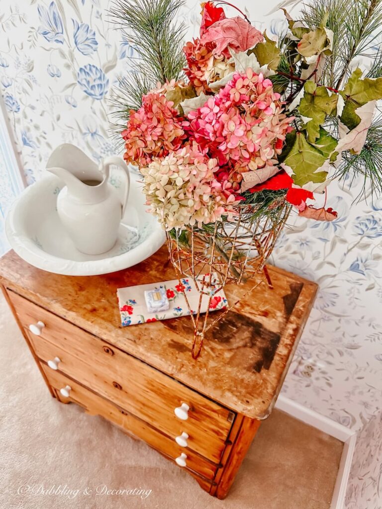 Vintage dresser with antique wash basin and pitcher