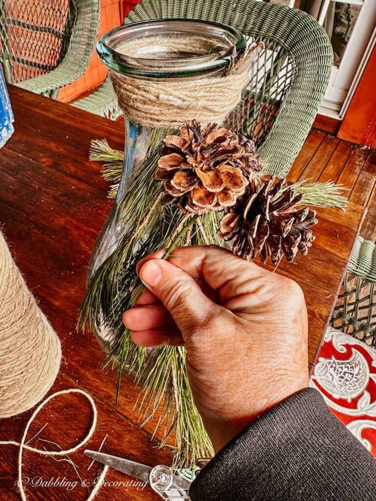 Pine Cones and evergreens on a Scandinavian outdoor bottle