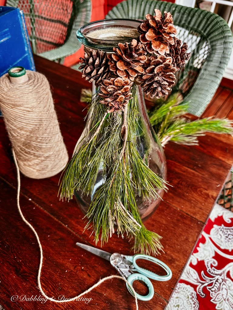 Pine Cones and evergreens on a Scandinavian outdoor bottle