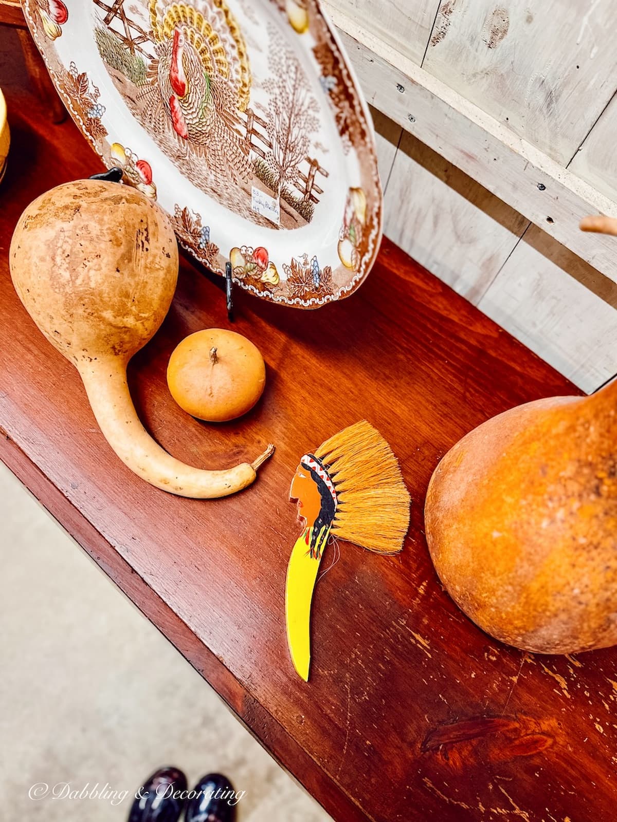 Antique Indian Brush, Thanksgiving vintage decor ideas in antique store next to turkey platter and ghourds