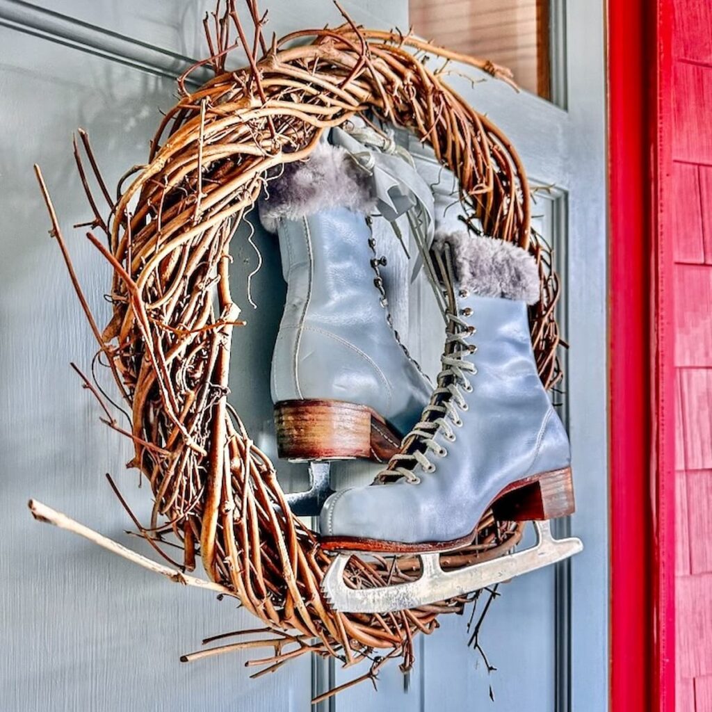 A festive wreath adorned with a pair of ice skates, perfect for adding charm to your 12 Days of Christmas decorations.