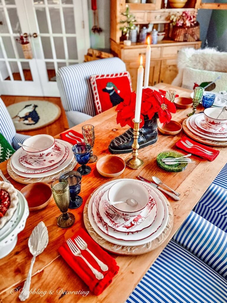 A cozy cabin table setting for Christmas in a dining room.