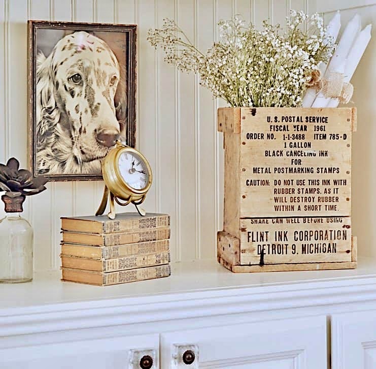 Vintage bookshelf decor in neutral styling.