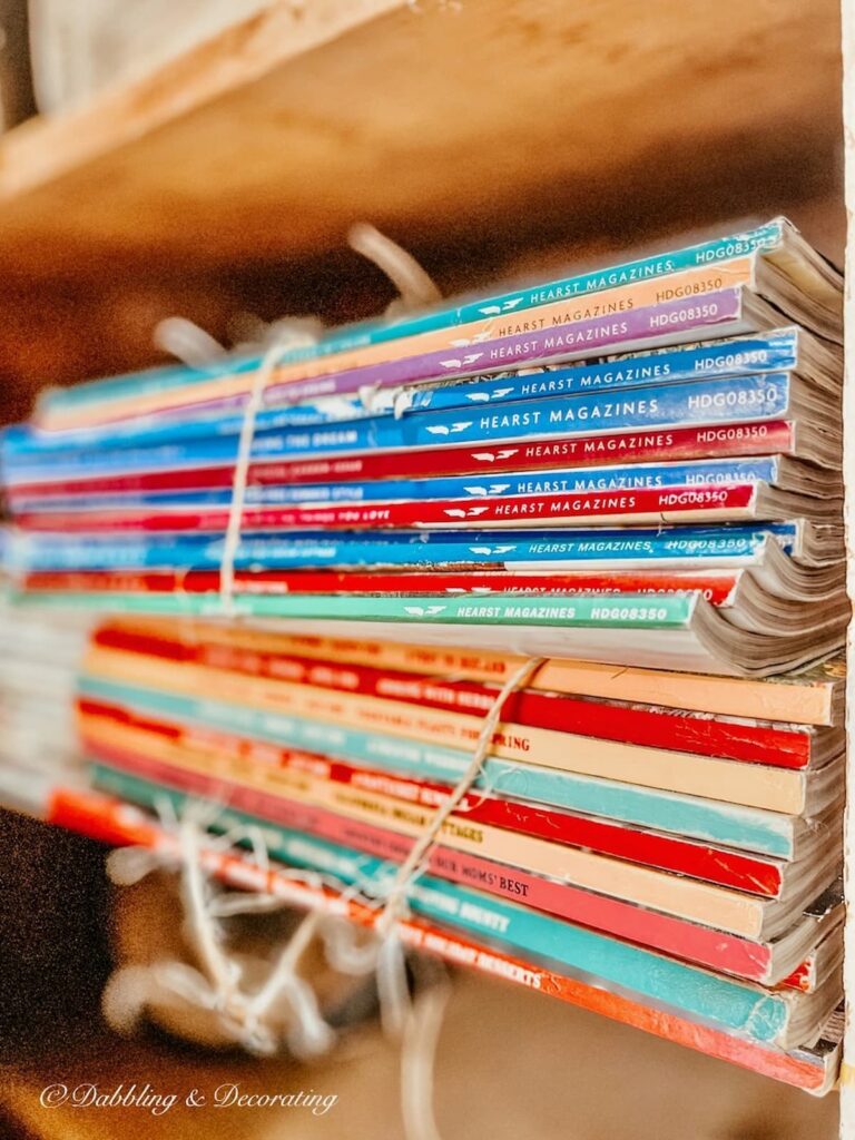 Stack of vintage magazine colorful on a shelf.