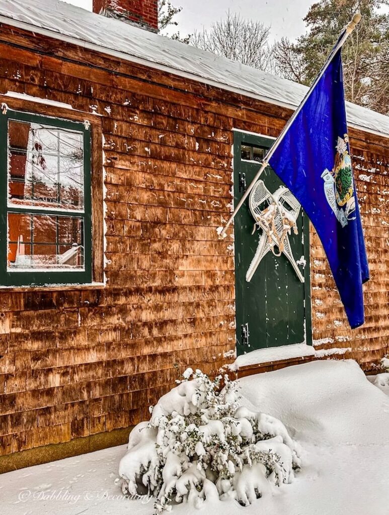 Snowshoes on Front Door with Maine Flag