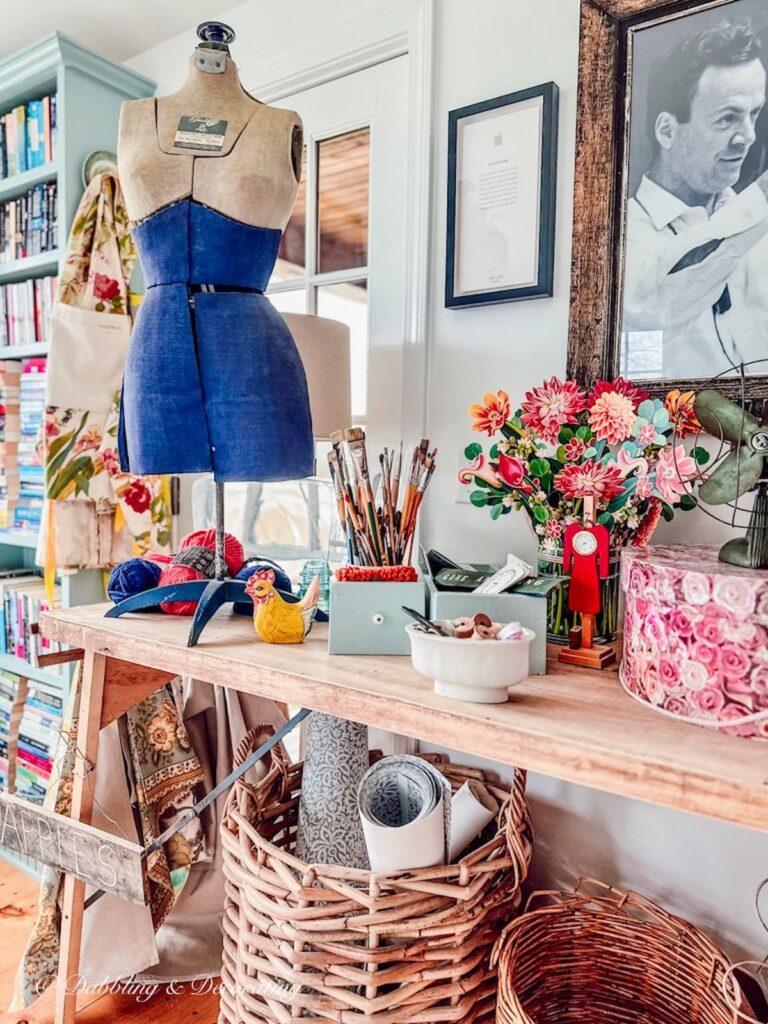 Vintage dress form Mannequin thrifting trends on craft table.