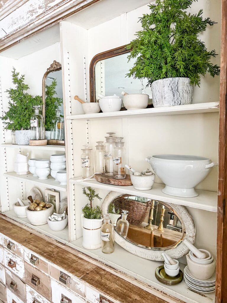 Farmhouse bookshelves with vintage finds.