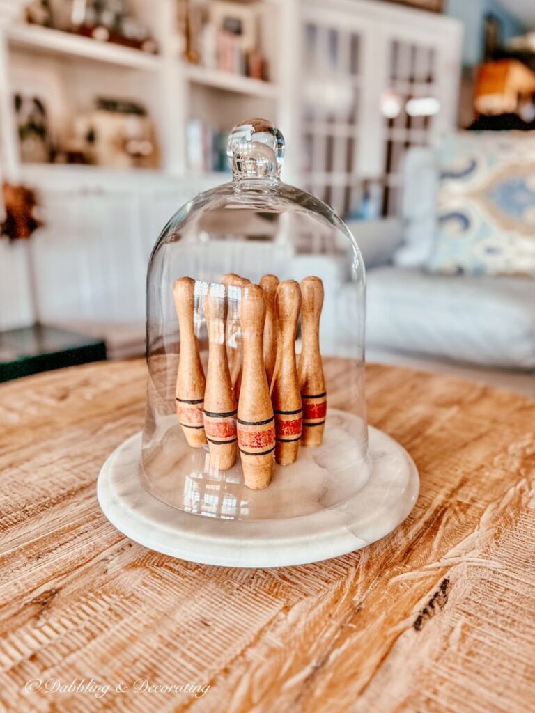 Marble Lazy Susan on coffee table with miniature bowling pins.