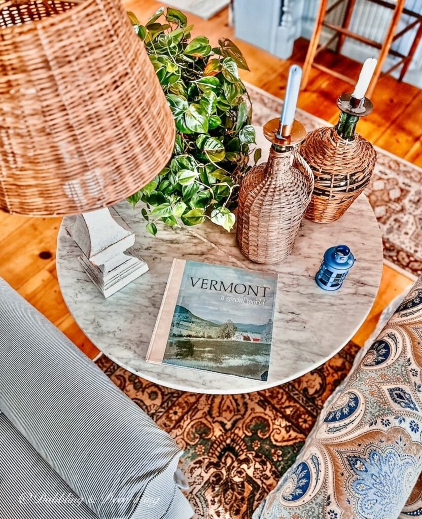 Marble side table with winter collections and lamp.