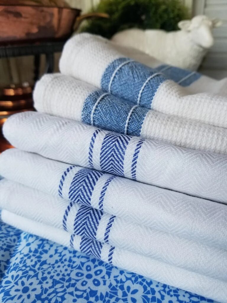Blue and white gifts for her with vintage dish towels.