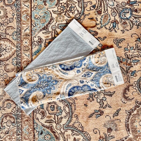 Vintage Turkish Rug for living room with blue and brown fabric swatches. How to choose a vintage rug.