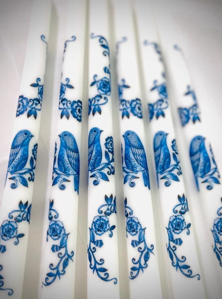 Set of blue and white tapered candles for hostess gift ideas.