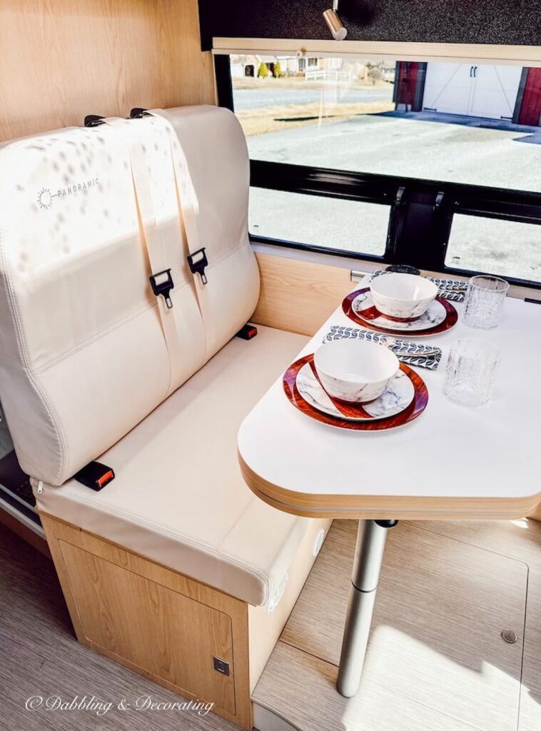 RV seating and dining table with dinnerware.