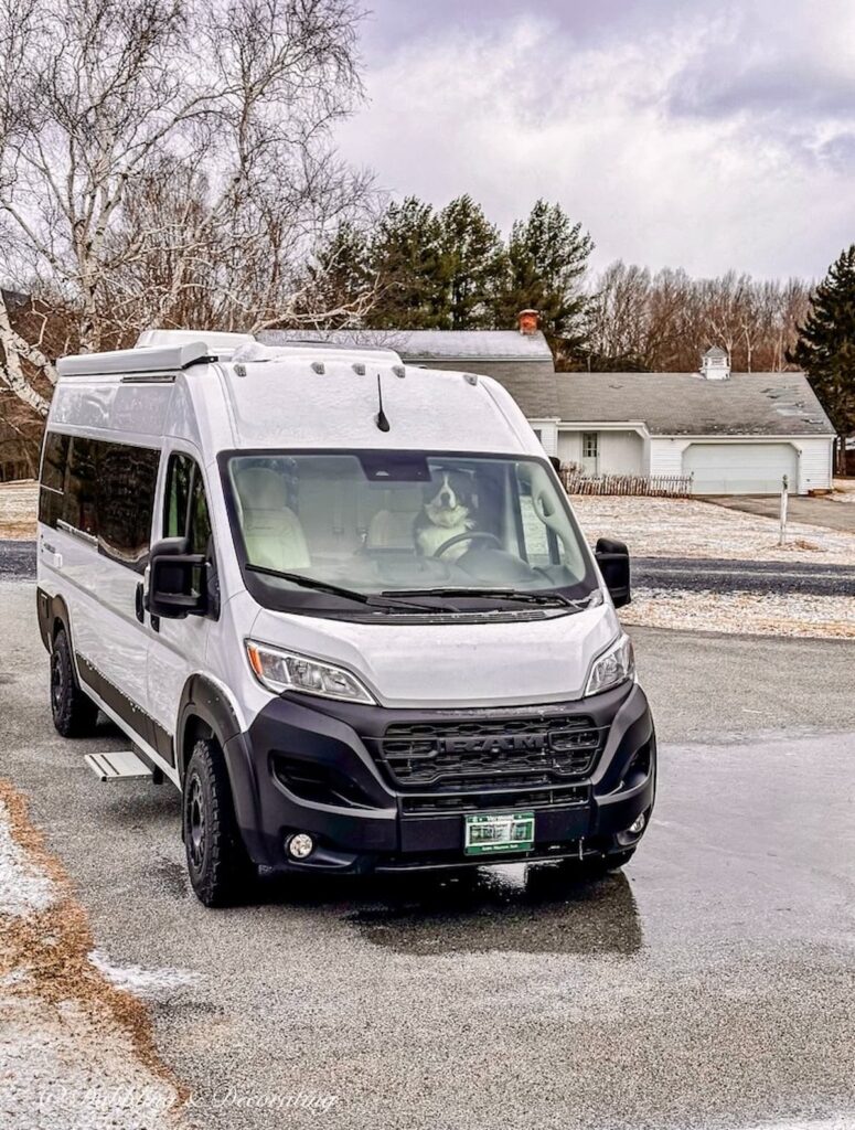 Panoramic RV with Bernese Mountain Dog in front seat.