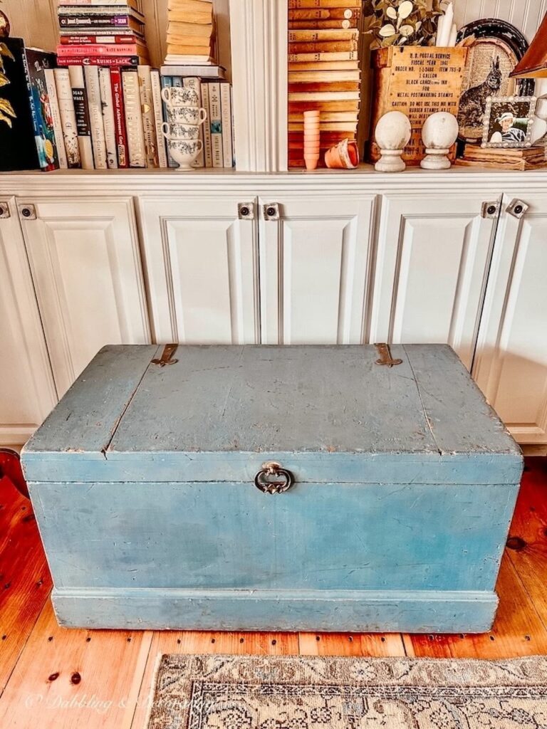 Vintage Rustic Blue Trunk in cozy corner book nook.
