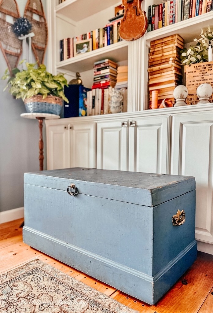 Vintage Rustic Blue Trunk in cozy corner book nook.