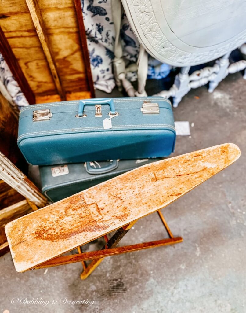 Vintage Wooden Child's Ironing Board at Vintage Marketplace with Old suitcases.