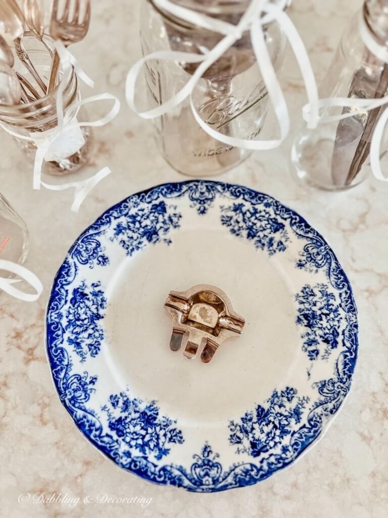 Vintage Silverware in Mason Jars with Blue Dish on Counter with vintage silverware demi tray.