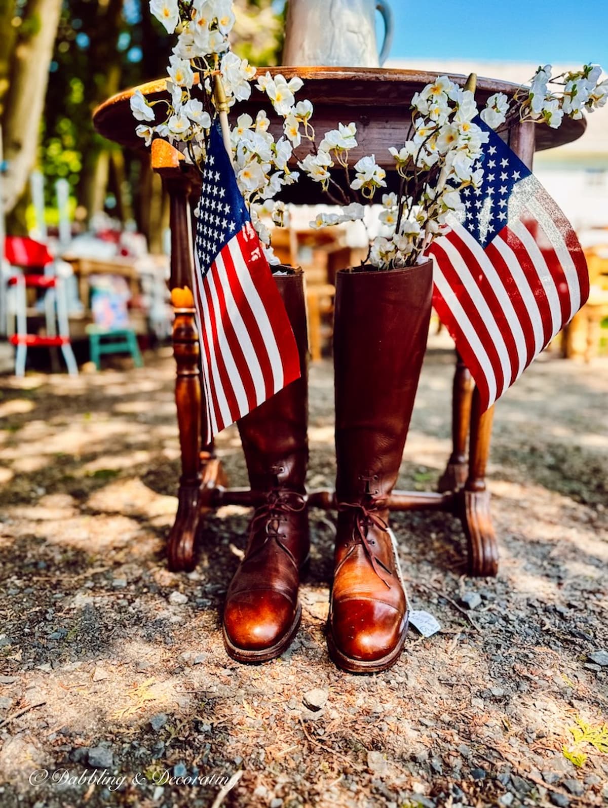 Vintage Boots with USA Flags at Barn Sale for summer home decor ideas.