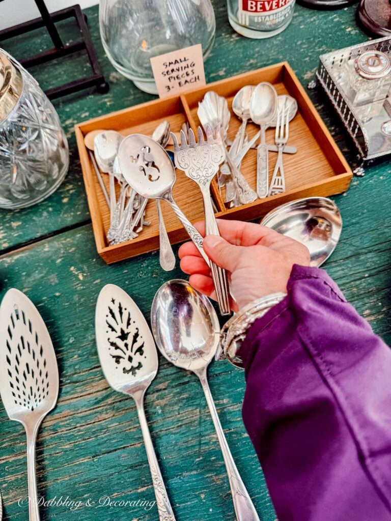 Vintage silverware in hand at Elephant Trunk's Flea Market.