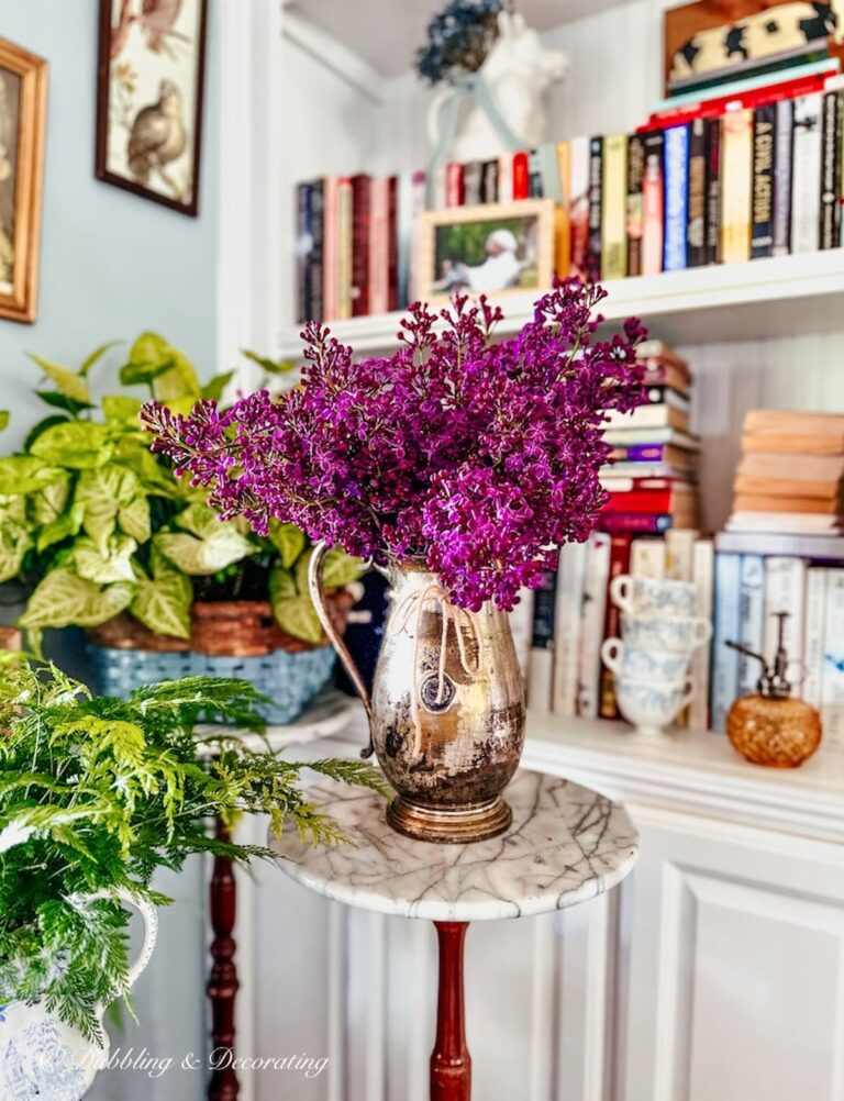 Purple Lilac Bouquet in vintage silver pitcher in Book Nook Vintage Decor Ideas