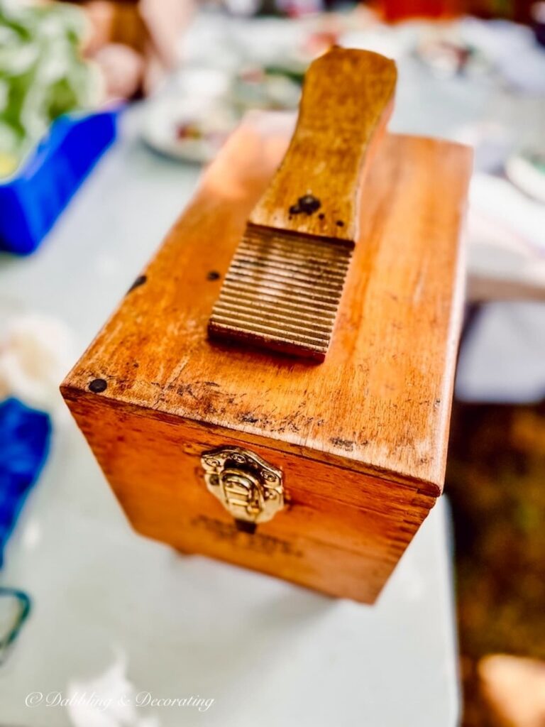 Vintage wooden shoe shine box at thrift shop.