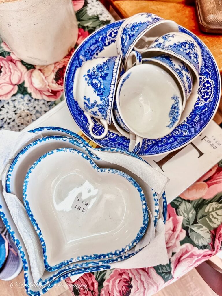 Vintage blue and white decorative elements in thrift shop check out counter.
