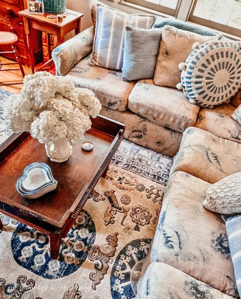 Vintage home with thrifted finds in living room in blue and white hues.